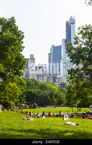 New York City - June 22: Tourist and locals enjoying the sun on the southern meadows of Central Park in New York Stock Photo