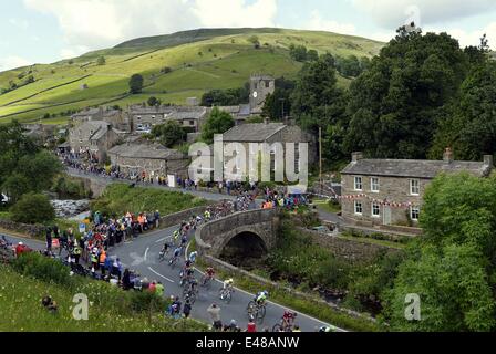 Muker, Yorkshire, UK. July 5th 2014.  Stage One of the Tour de France passes through the village in Swaledale. Stage one runs from Leeds to Harrogate:    STUART WALKER / ALAMY NEWS Stock Photo