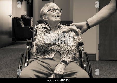 Elderly woman and caregiver Stock Photo