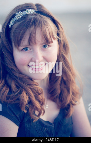 Portrait of smiling teenage girl (13-15) with headband Stock Photo