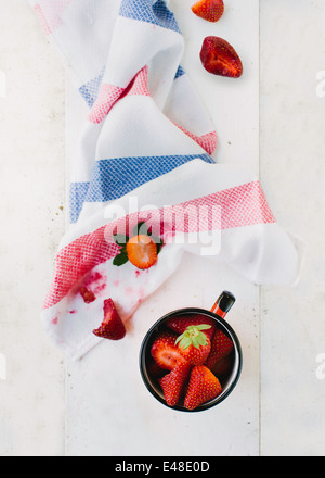 View from above on strawberries and stained dishtowel Stock Photo