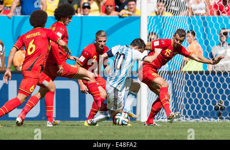 Brasilia, Brazil. 5th July, 2014. Belgium's Daniel Van Buyten (1st R), Toby Alderweireld (3rd R), Marouane Fellaini (2nd L) and Axel Witsel (1st L) defend against Argentina's Lionel Messi during a quarter-finals match between Argentina and Belgium of 2014 FIFA World Cup at the Estadio Nacional Stadium in Brasilia, Brazil, on July 5, 2014. Argentina won 1-0 over Belgium and qualified for the semi-finals. Credit:  Qi Heng/Xinhua/Alamy Live News Stock Photo