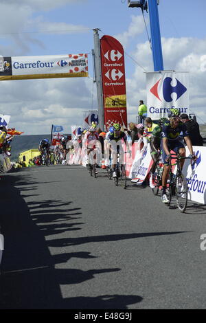 2014 Tour de France Stage 1. Riders of the Pelaton cross the summit of the Cote de Grinton Moor Stock Photo