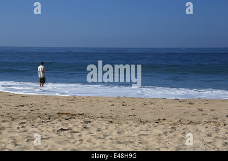 Man fishing on seabright beach, on east cliff in Santa Cruz, Pacific Ocean Stock Photo