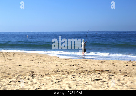 Man fishing on seabright beach, on east cliff in Santa Cruz, Pacific Ocean Stock Photo