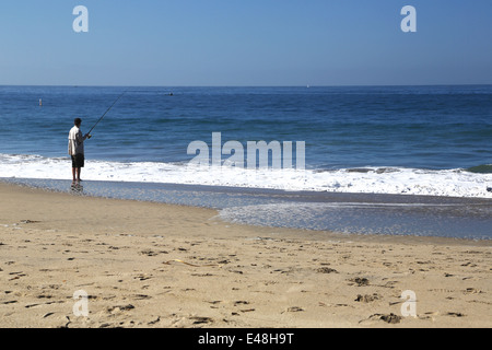 Man fishing on seabright beach, on east cliff in Santa Cruz, Pacific Ocean Stock Photo