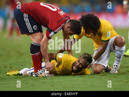 Fortaleza, Brazil. 04th July, 2014. Neymar (C) of Brazil lies on the pitch after picking up an injury during the FIFA World Cup 2014 quarter final match soccer between Brazil and Colombia at the Estadio Castelao in Fortaleza, Brazil, 04 July 2014. Credit:  Action Plus Sports/Alamy Live News Stock Photo