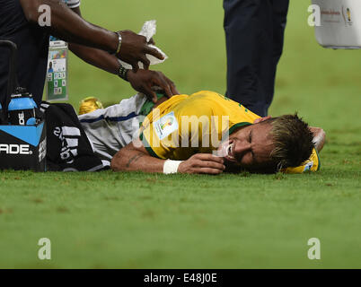 Fortaleza, Brazil. 04th July, 2014. Neymar of Brazil receives medical assistance after picking up an injury during the FIFA World Cup 2014 quarter final match soccer between Brazil and Colombia at the Estadio Castelao in Fortaleza, Brazil, 04 July 2014. Credit:  Action Plus Sports/Alamy Live News Stock Photo