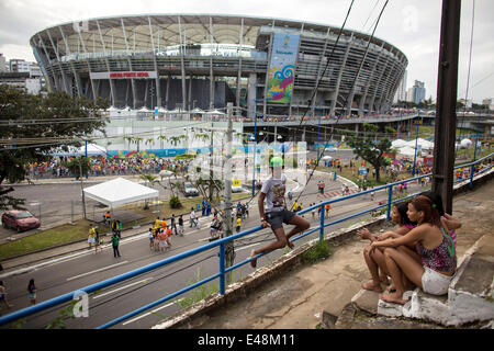 Salvador, Brazil. 5th July, 2014. Local residents sit on stairs near the Arena Fonte Nova Stadium prior to a quarter-finals match between Netherlands and Costa Rica of 2014 FIFA World Cup in Salvador, Brazil, on July 5, 2014. Credit:  Guillermo Arias/Xinhua/Alamy Live News Stock Photo