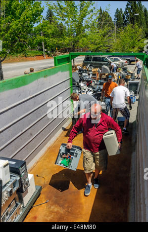 Volunteers helping at electronic waste collection - community fundraiser for education program, Grass Valley California USA Stock Photo