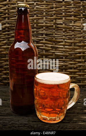 Traditional Craft beer bottle with taster half pint glass of craft beer Stock Photo