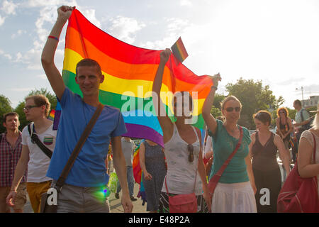 Budapest, Hungary. 5th July, 2014. Participants of the Gay Pride Parade march across the city in Budapest, Hungary, July 5, 2014. The theme of the parade was 'Budapest Pride: 365', meaning that participants were striving for acceptance through the year, not just on this day. Various groups claiming to represent 'family values' held counter-demonstrations along the parade route. Police arrested two demonstrators. Credit:  Attila Volgyi/Xinhua/Alamy Live News Stock Photo