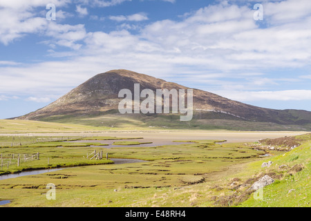 Salt marshes on the Isle of Harris. The mountain behind is known as Ceapabhal. The area is part of the Outer Hebrides, Scotland. Stock Photo