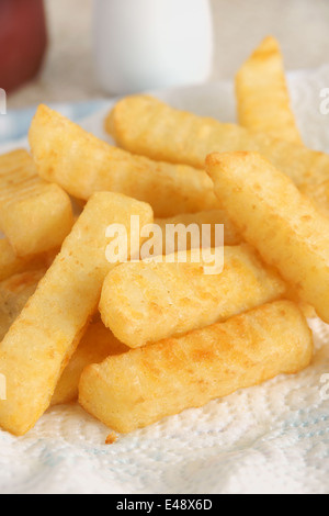 Freshly cooked crinkle cut chips or French fries Stock Photo