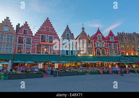BRUGES, BELGIUM - JUNE 12, 2014: The houses of the Grote Markt square at dusk. Stock Photo