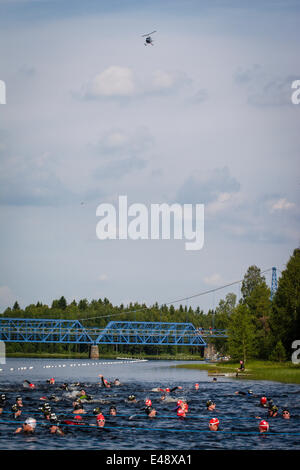 Just before start of 2014 Vansbrosimning, first heat. In the helicopter above Lars Erlman is arriving. Stock Photo