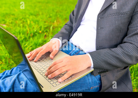 male hands of a businessman working with a laptop Stock Photo