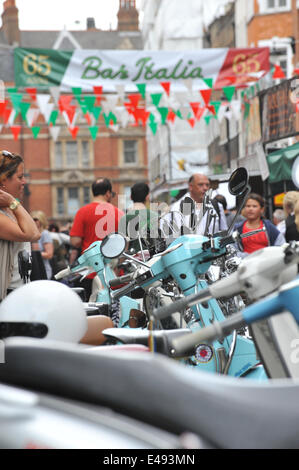 Frith Street, London, UK. 6th July 2014. Bar Italia celebrates its 65th birthday with Italian colours, scooters, food stalls and entertainment. Credit:  Matthew Chattle/Alamy Live News Stock Photo