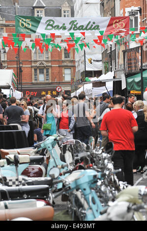 Frith Street, London, UK. 6th July 2014. Bar Italia celebrates its 65th birthday with Italian colours, scooters, food stalls and entertainment. Credit:  Matthew Chattle/Alamy Live News Stock Photo