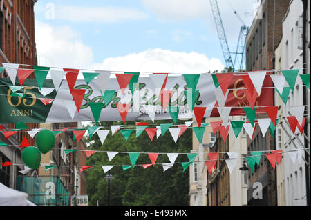 Frith Street, London, UK. 6th July 2014. Bar Italia celebrates its 65th birthday with Italian colours, scooters, food stalls and entertainment. Credit:  Matthew Chattle/Alamy Live News Stock Photo