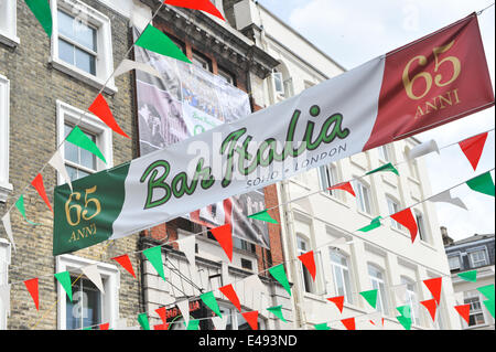 Frith Street, London, UK. 6th July 2014. Bar Italia celebrates its 65th birthday with Italian colours, scooters, food stalls and entertainment. Credit:  Matthew Chattle/Alamy Live News Stock Photo