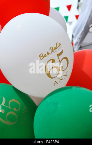 Frith Street, London, UK. 6th July 2014. Bar Italia celebrates its 65th birthday with ballons in Italian colours, scooters, food stalls and entertainment. Credit:  Matthew Chattle/Alamy Live News Stock Photo