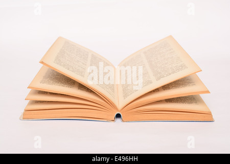 Old open book on white background Stock Photo