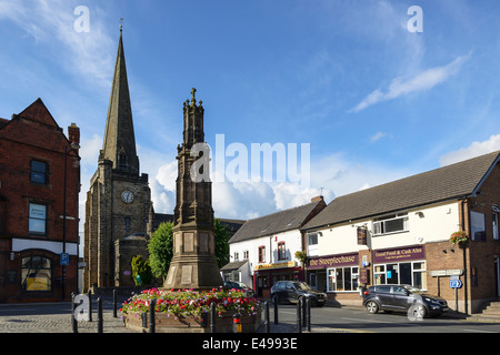 Church spire and the war memorial in Uttoxeter town centre UK Stock Photo