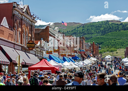 Historic buildings and crowd during Donkey Derby Days, Main Street, Cripple Creek, Colorado USA Stock Photo