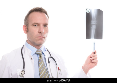 Serious professional doctor pointing on an x-ray with his pen to show an injury Stock Photo