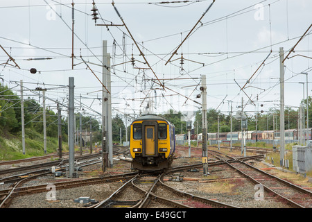 Diesel Multiple Unit (DMU) Class 156 operated by Northern Rail approaching Carnforth Station, Lancashire Stock Photo