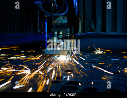 Laser cutting with sparks close up Stock Photo