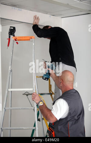 Two electricians working together Stock Photo