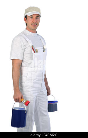 Male painter carrying paint pots Stock Photo