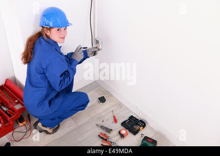 Female electrician Stock Photo
