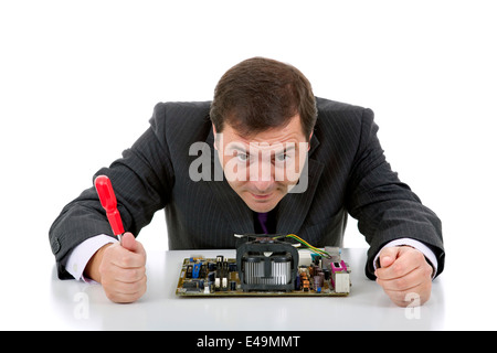 Computer engineer working in a motherboard, isolated Stock Photo