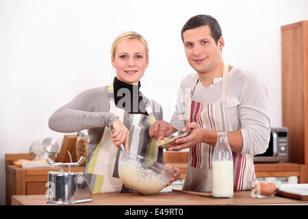 Couple baking in kitchen Stock Photo