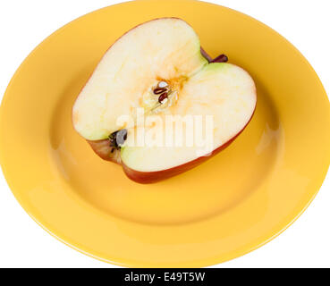 Half an apple on a plate. Stock Photo