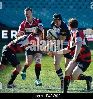 Sydney, Australia. 6th July, 2014. Macquarie University players attempt a tackle on Sydney Convicts forward during historic match against Macquarie University at the Allianz Stadium. Credit:  MediaServicesAP/Alamy Live News Stock Photo