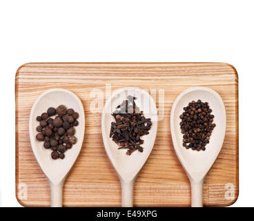 Spices and herbs on wooden spoons. Stock Photo