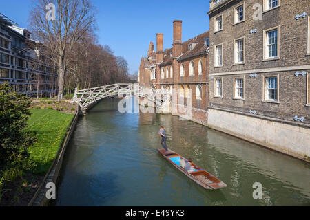 Mathematical Bridge, connecting two parts of Queens College, with punters on the river, Cambridge, England, United Kingdom Stock Photo