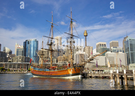 A replica of James Cook's HMS Endeavour, moored alongside the Australian National Maritime Museum in Darling Harbour, Sydney. Stock Photo