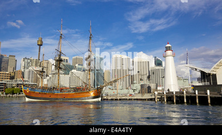 A replica of James Cook's HMS Endeavour, moored alongside the Australian National Maritime Museum in Darling Harbour, Sydney. Stock Photo