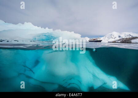 Above and below view of glacial ice near Wiencke Island, Neumayer Channel, Antarctica, Polar Regions Stock Photo