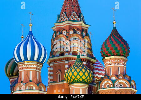 Onion domes of St. Basil's Cathedral in Red Square illuminated in the evening, UNESCO, Moscow, Russia Stock Photo