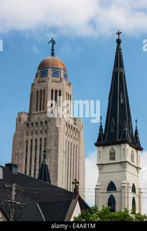 lincoln, nebraska, usa,, the spires of the state capitol building and Saint Marys Catholic Church Stock Photo