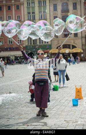 The Man letting soap bubbles Old Market Wroclaw Stock Photo