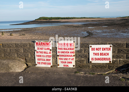 Warning or Danger Signs in front of Sully Island Swanbridge South Wales Stock Photo
