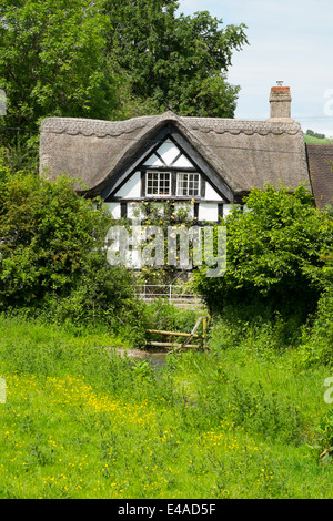 A thatched black and white cottage in the Village of Hopton Castle, South Shropshire, England. Stock Photo