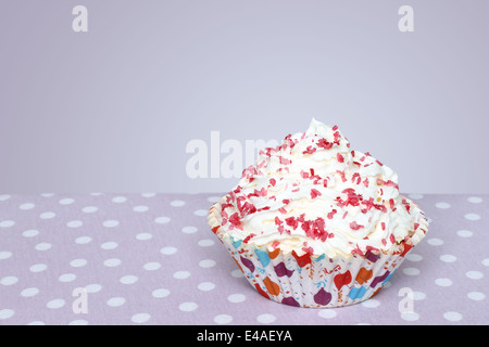 Cupcake on vintage retro background Stock Photo